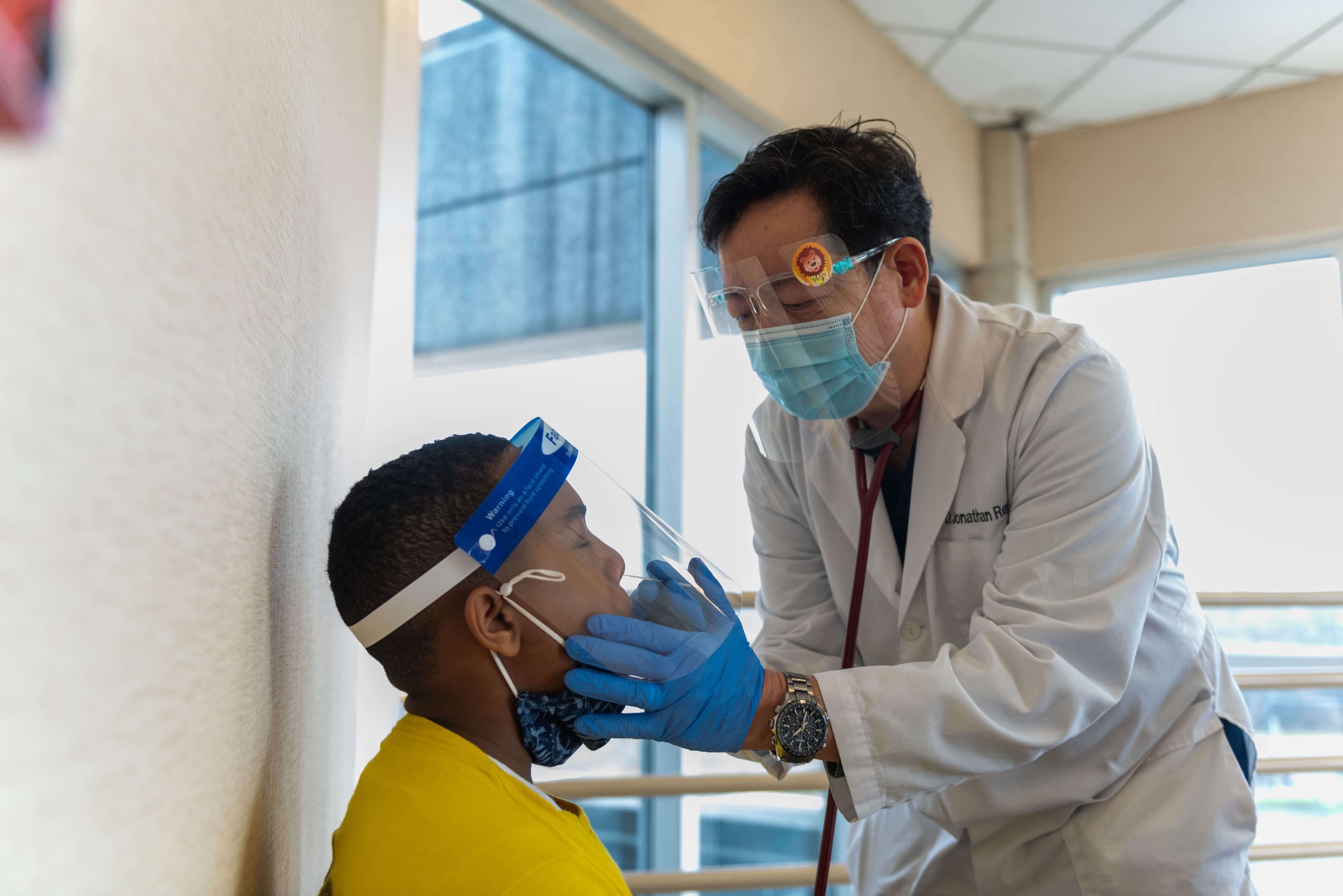 A doctor treating their patient